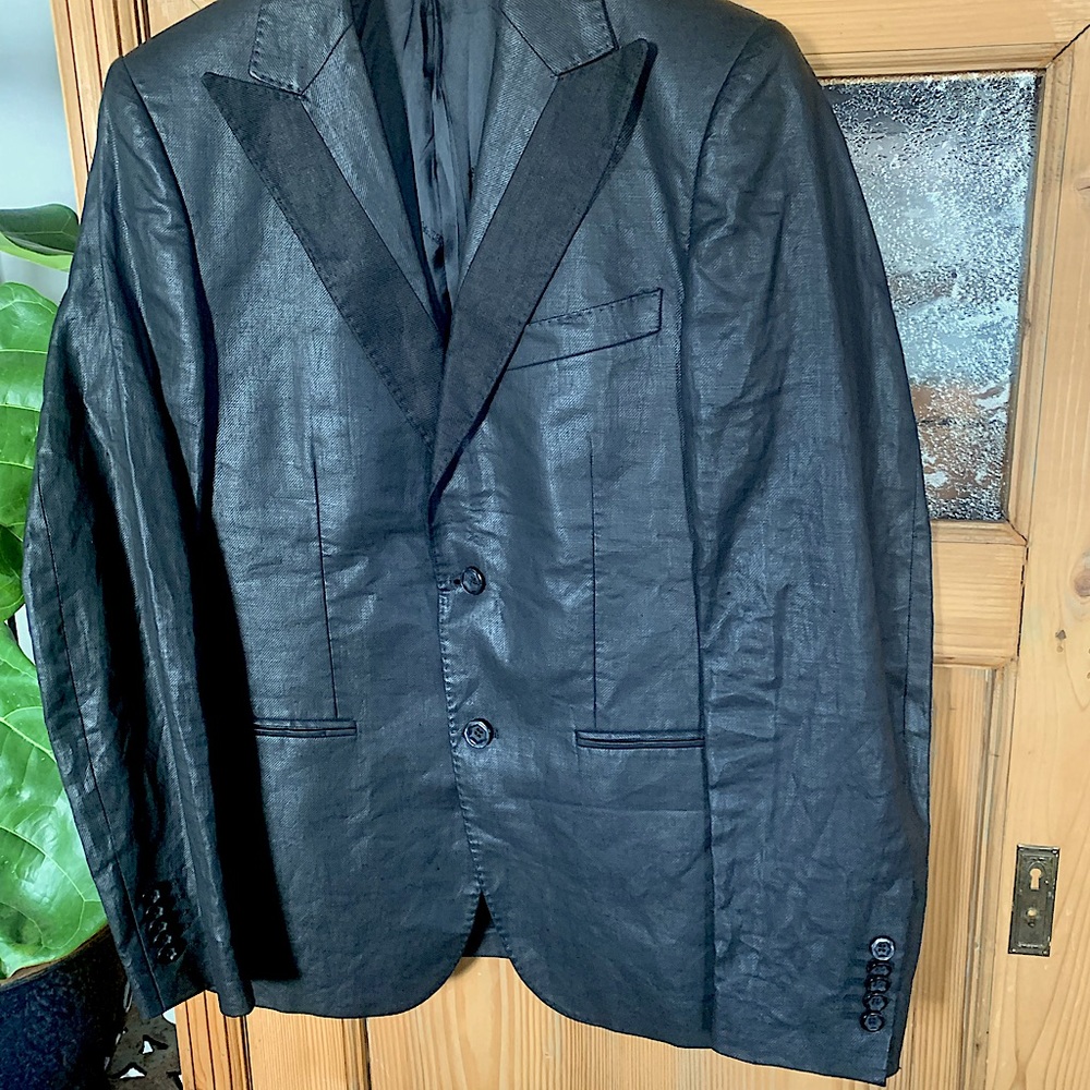 Made in Italy, unisex blazer.  The fabric is lovely and very unique.